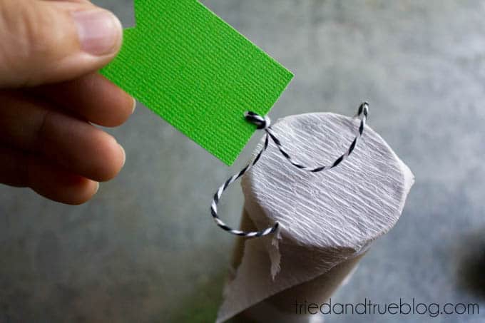 Tag at the end of a mini mummy pinata for Halloween