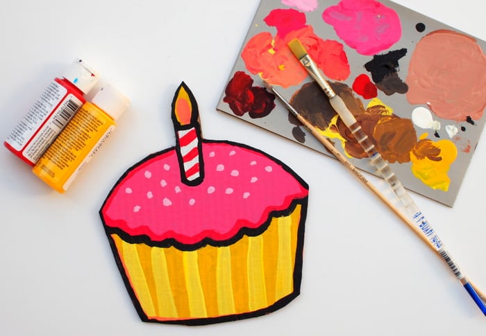Painting a big birthday card with acrylic paint