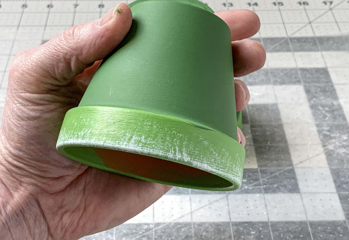 Clay pot painted green to make a Christmas tree