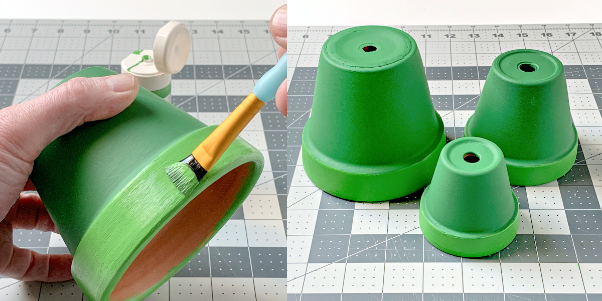 Painting the rims of three clay pots with green craft paint